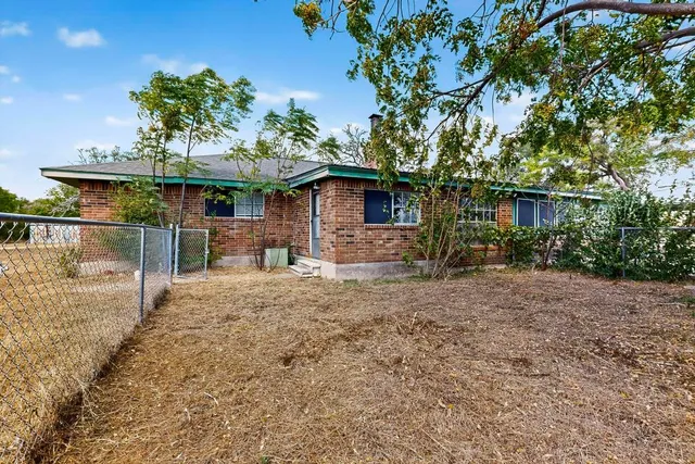 a backyard of a house with lots of green space