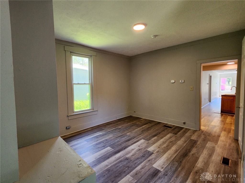 211 Race Street Spring Valley, OH 45370 - Photo 8 of 12 This living area features durable flooring, offering a comfortable and adaptable space for diverse design preferences.