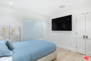 1347 Palisades Beach Road Santa Monica, CA 90401 - Photo 24 of 64 a bedroom with a bed and a flat screen tv