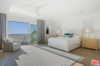 1347 Palisades Beach Road Santa Monica, CA 90401 - Photo 29 of 64 a spacious bedroom with a bed and a couch