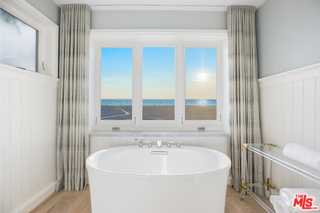 1347 Palisades Beach Road Santa Monica, CA 90401 - Photo 33 of 64 a white bath tub sitting next to a white toilet