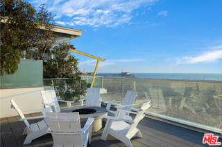 1347 Palisades Beach Road Santa Monica, CA 90401 - Photo 44 of 64 a view of a lake with furniture and wooden floor