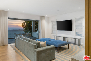 1347 Palisades Beach Road Santa Monica, CA 90401 - Photo 50 of 64 a living room with furniture and a flat screen tv