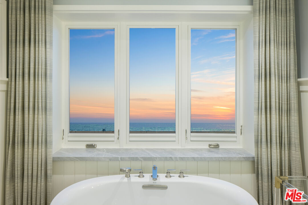1347 Palisades Beach Road Santa Monica, CA 90401 - Photo 58 of 64 a bathroom with a sink and a mirror