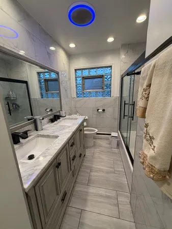 a bathroom with sink and mirror