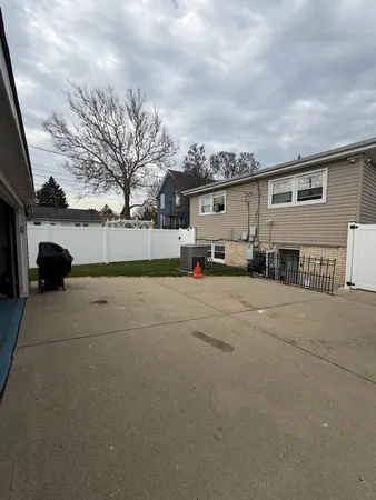 a view of a car parked in front of a house