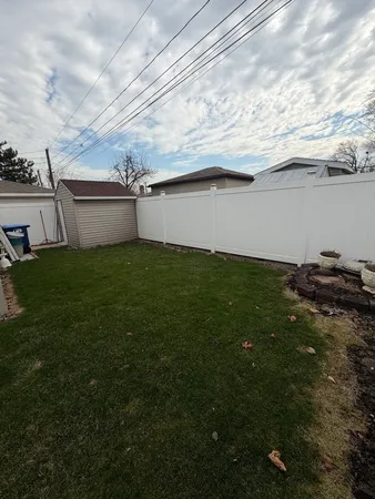 a view of a backyard of the house
