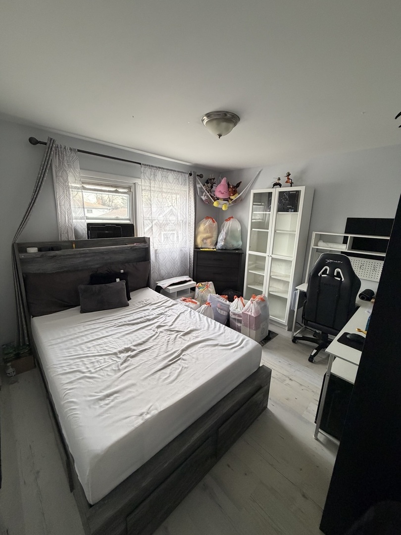 1643 Sycamore Street Des Plaines, IL 60018 - Photo 10 of 27 a bed sitting in a bedroom and dresser