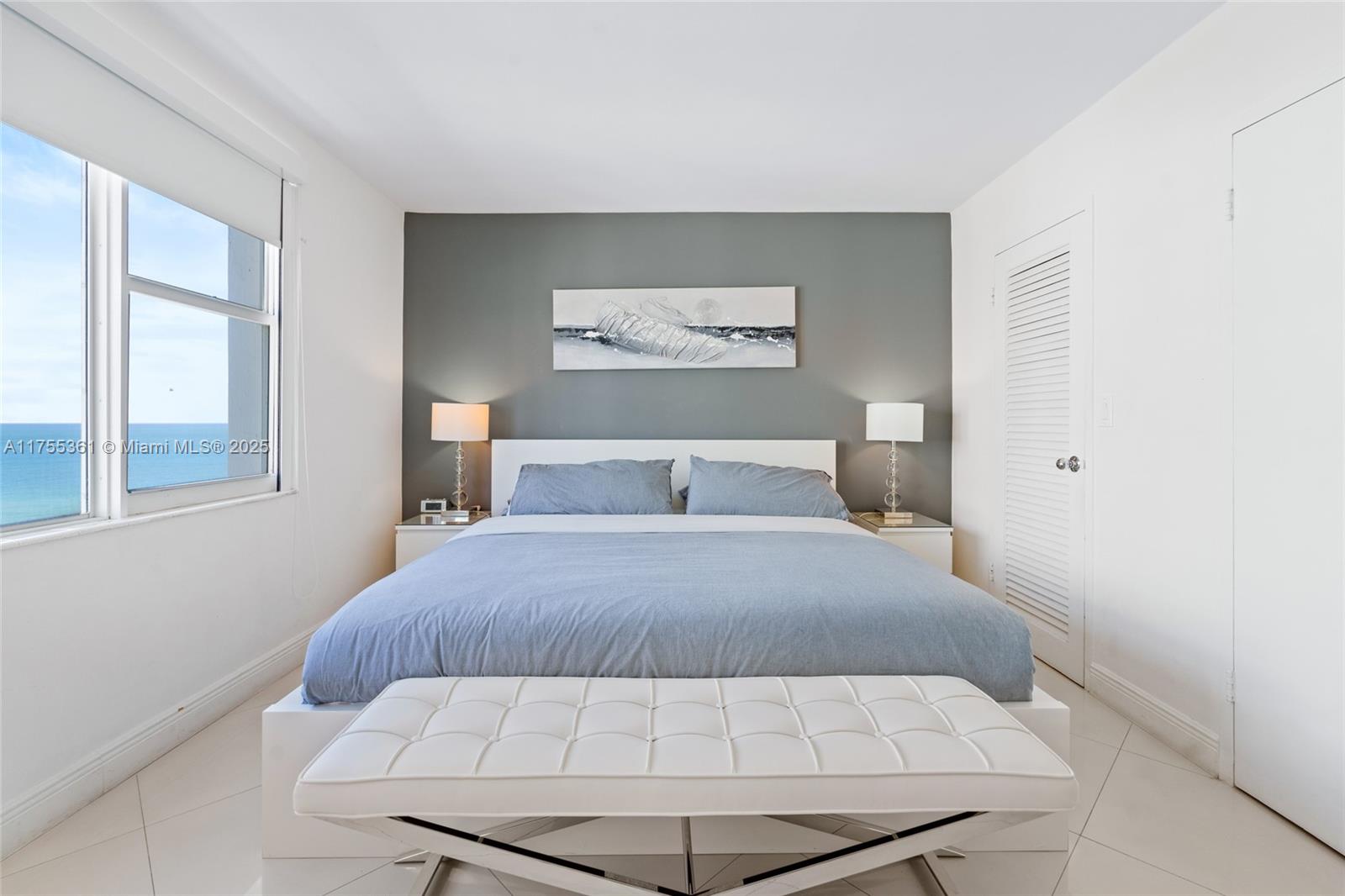 9195 Collins Avenue, Unit 1103 Surfside, FL 33154 - Photo 12 of 23 a bedroom with a bed and window