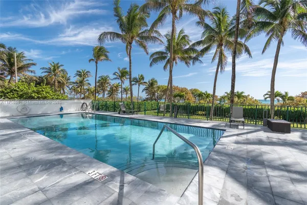 a view of swimming pool with a table and chairs
