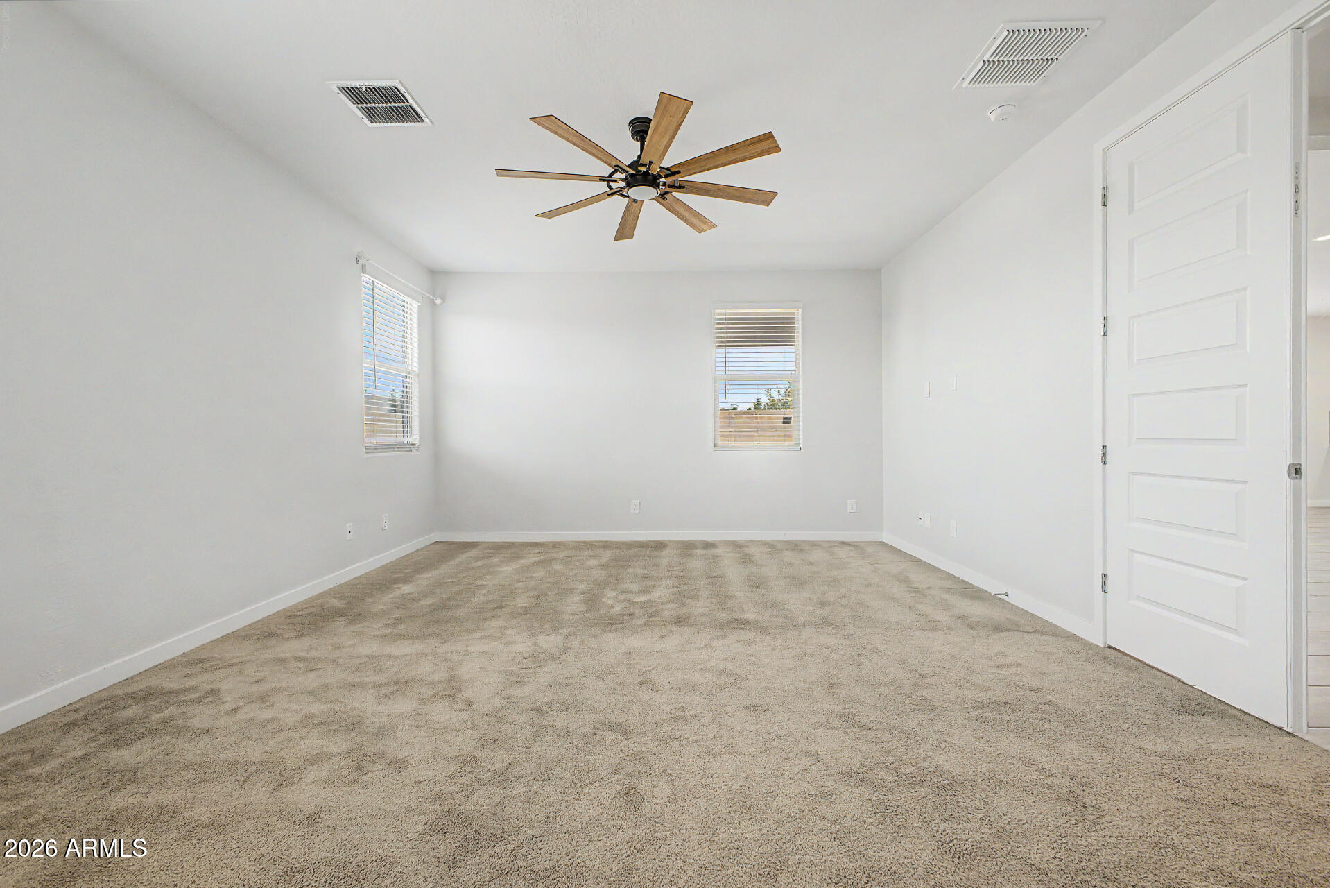 23080 East Stacey Road Queen Creek, AZ 85142 - Photo 16 of 42 a view of a livingroom with a ceiling fan and window