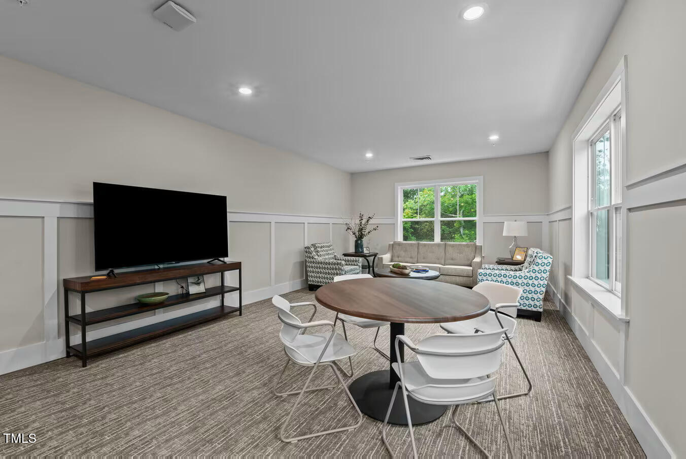 1001 Mulford Court, Unit B1 Knightdale, NC 27545 - Photo 11 of 41 a living room with furniture and a flat screen tv