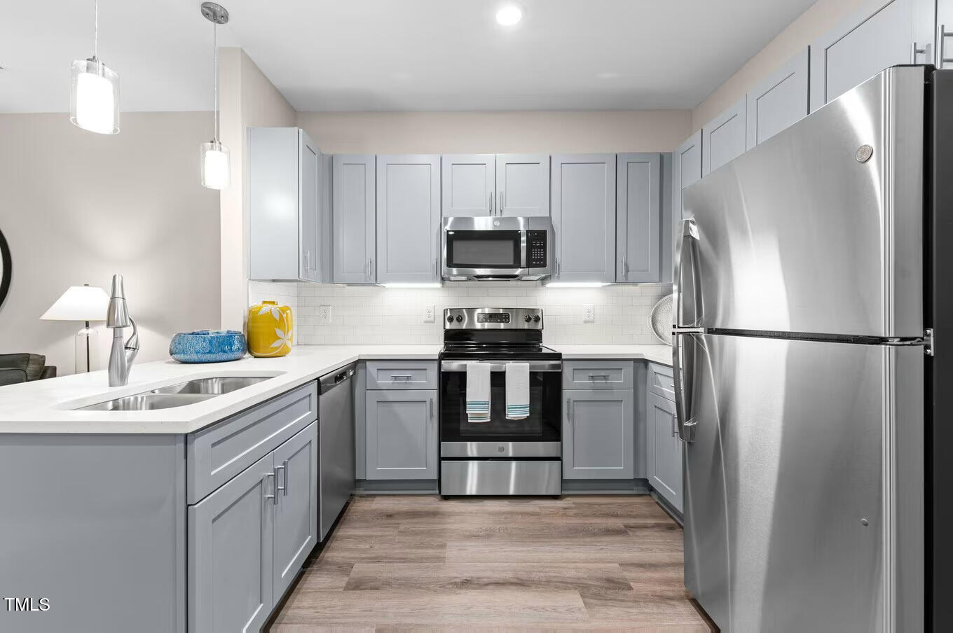 1001 Mulford Court, Unit B1 Knightdale, NC 27545 - Photo 19 of 41 a kitchen with a refrigerator and a sink