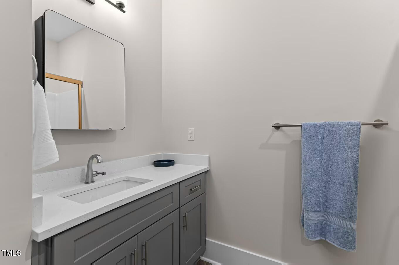 1001 Mulford Court, Unit B1 Knightdale, NC 27545 - Photo 22 of 41 a bathroom with a sink and a mirror