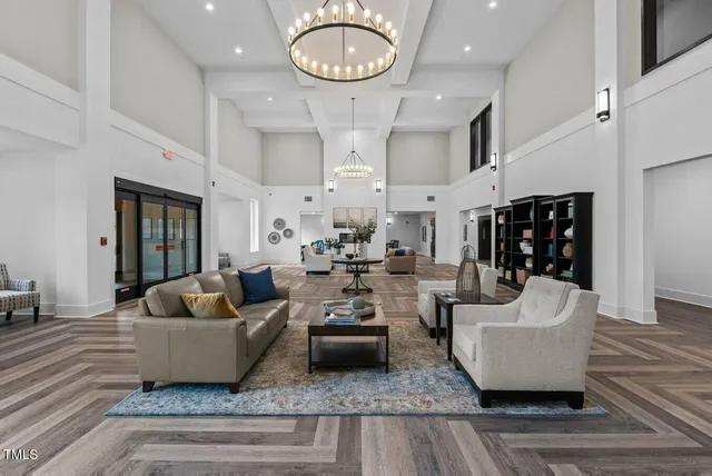 a living room with fireplace furniture and a wooden floor