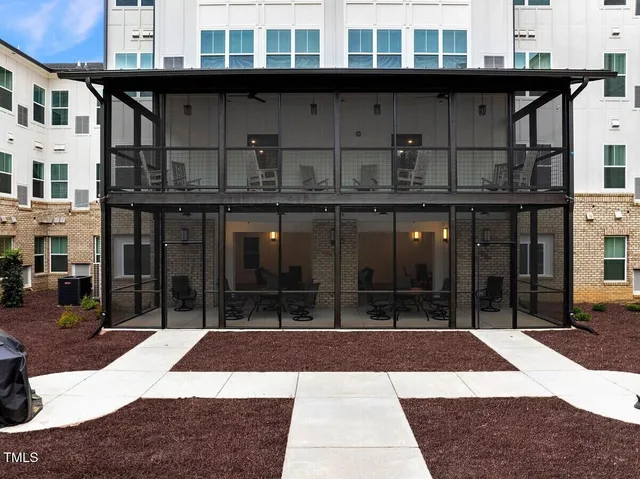 a view of a building with a sitting area