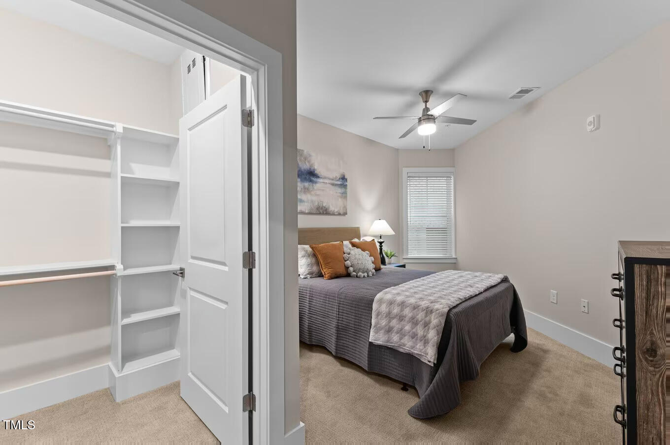 1001 Mulford Court, Unit B1 Knightdale, NC 27545 - Photo 6 of 41 a bedroom with a bed and a chandelier