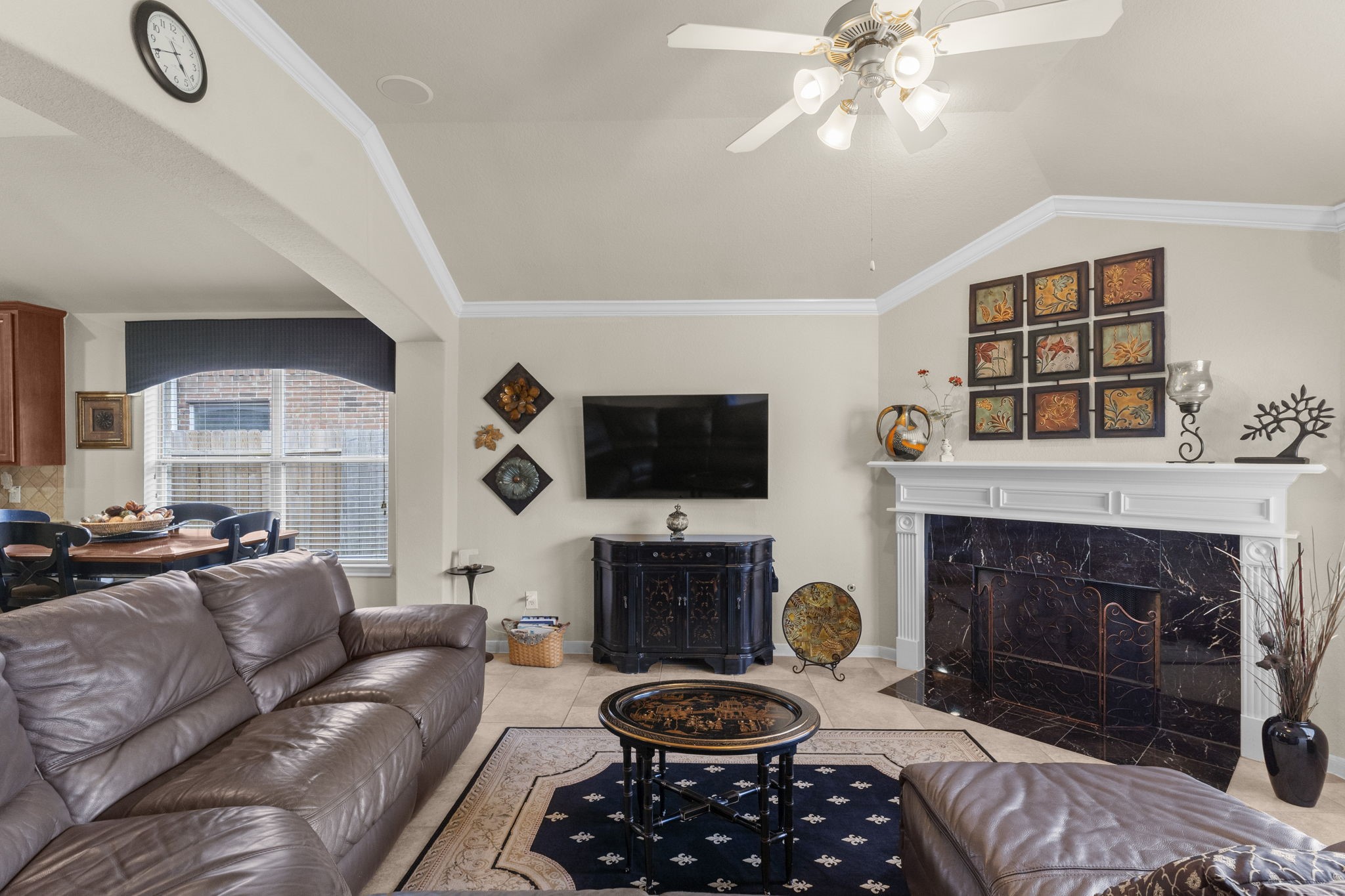 4618 Countrypines Drive Spring, TX 77388 - Photo 15 of 48 a living room with furniture a flat screen tv and a fireplace