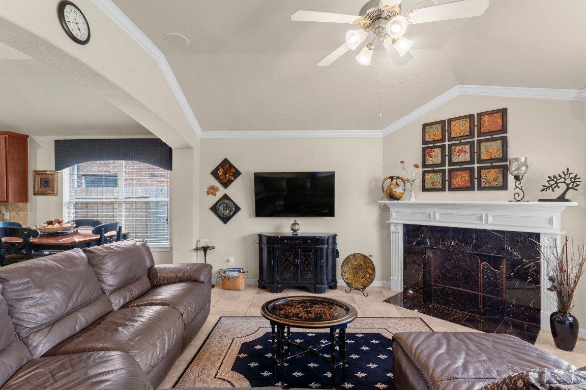 4618 Countrypines Drive Spring, TX 77388 - Photo 15 of 48 a living room with furniture a flat screen tv and a fireplace
