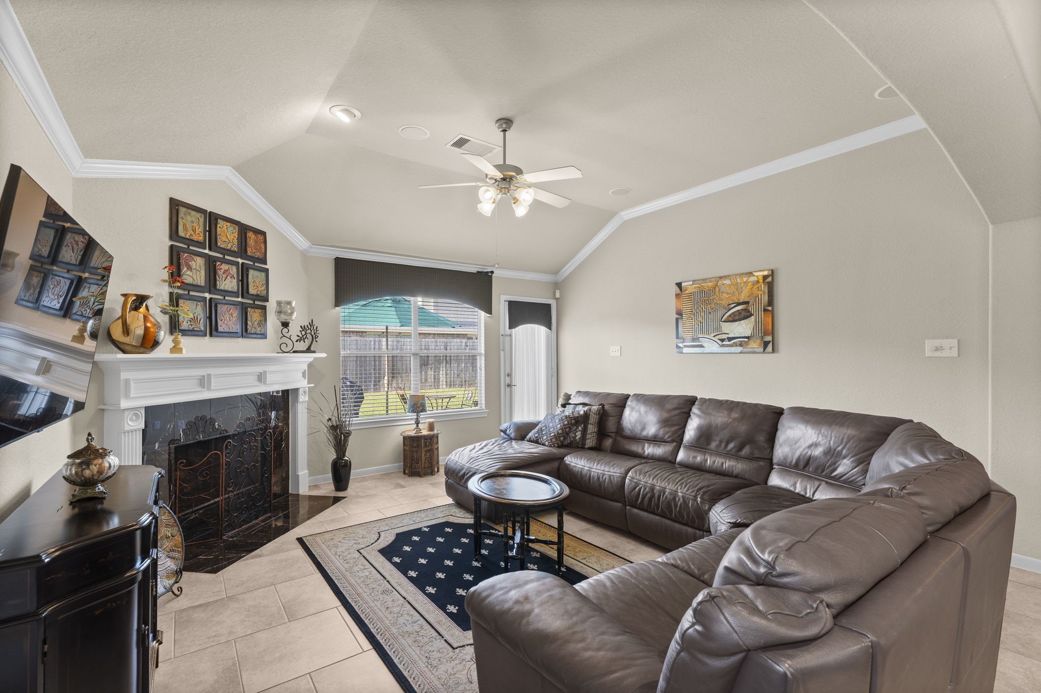 4618 Countrypines Drive Spring, TX 77388 - Photo 17 of 48 a living room with furniture a fireplace and a window