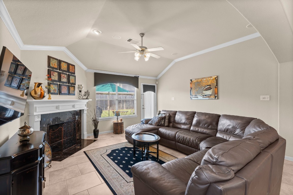 4618 Countrypines Drive Spring, TX 77388 - Photo 17 of 48 a living room with furniture a fireplace and a window