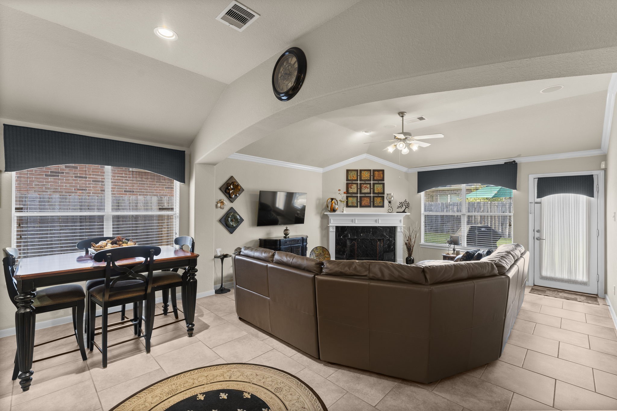 4618 Countrypines Drive Spring, TX 77388 - Photo 19 of 48 a living room with furniture a fireplace and a projector screen
