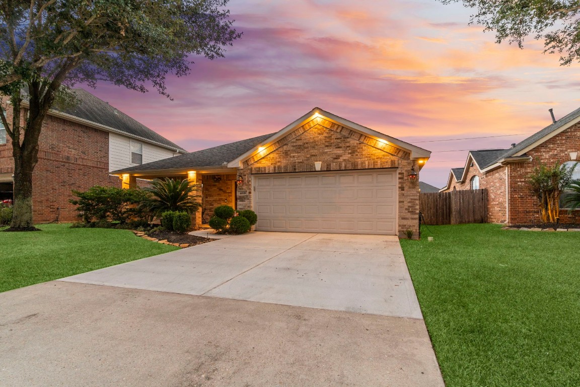 4618 Countrypines Drive Spring, TX 77388 - Photo 2 of 48 a view of a yard in front of house