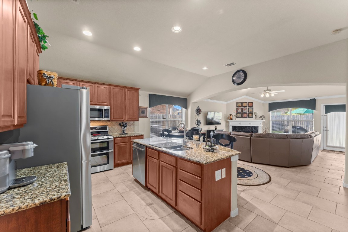 4618 Countrypines Drive Spring, TX 77388 - Photo 22 of 48 a kitchen with a stove a refrigerator and a stove