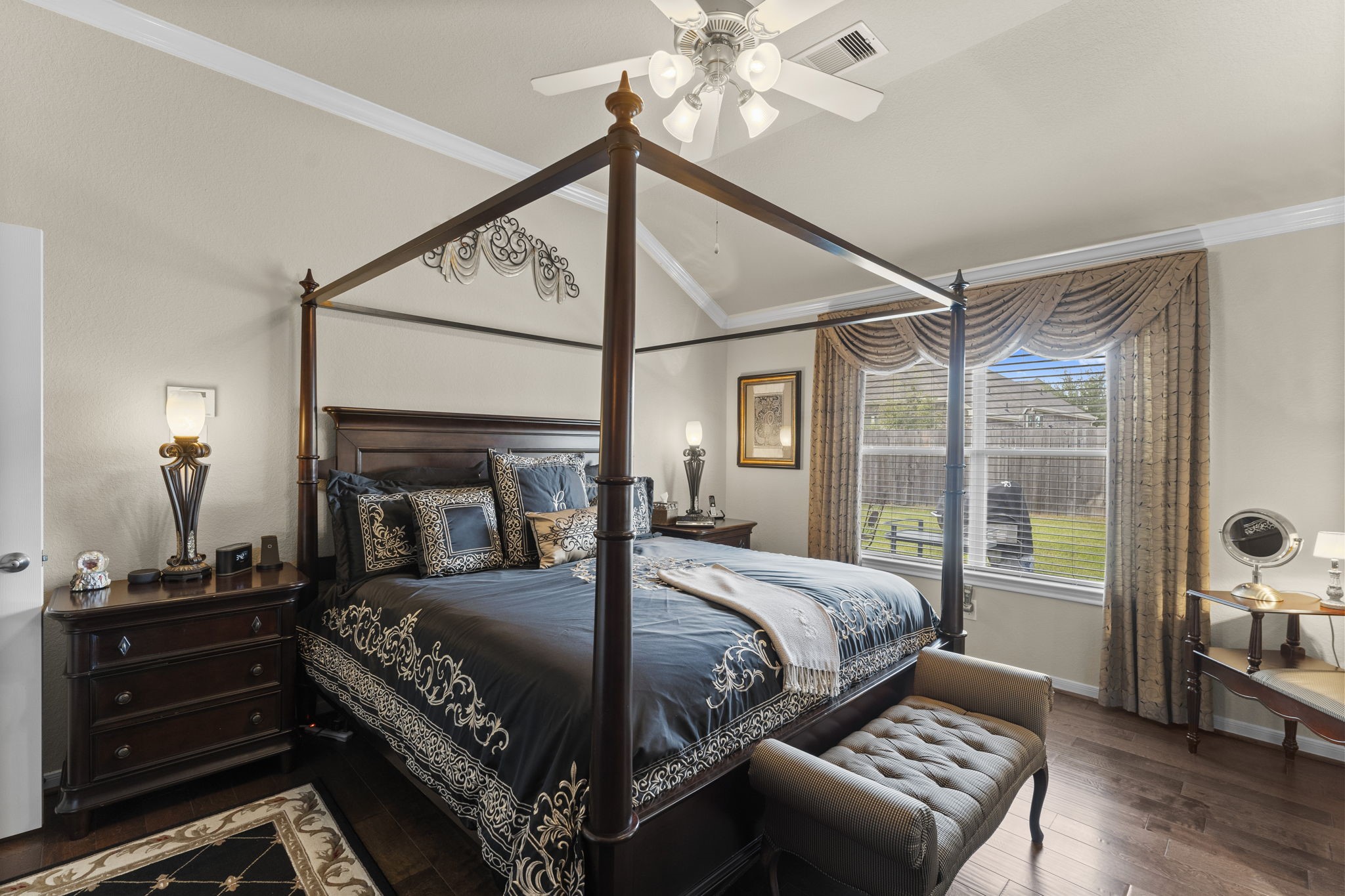 4618 Countrypines Drive Spring, TX 77388 - Photo 27 of 48 a bedroom with a bed and a chandelier