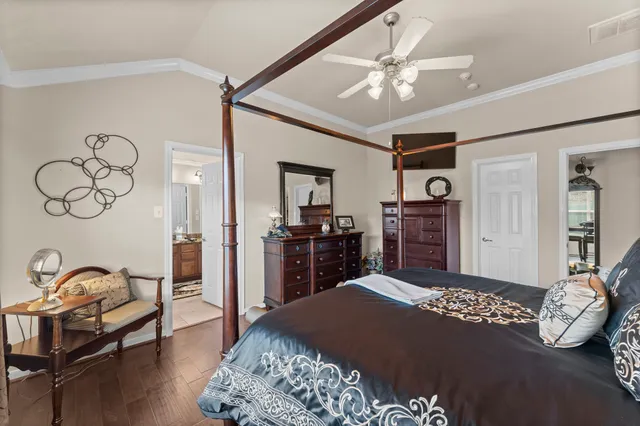 a bathroom with a granite countertop sink and a bathtub