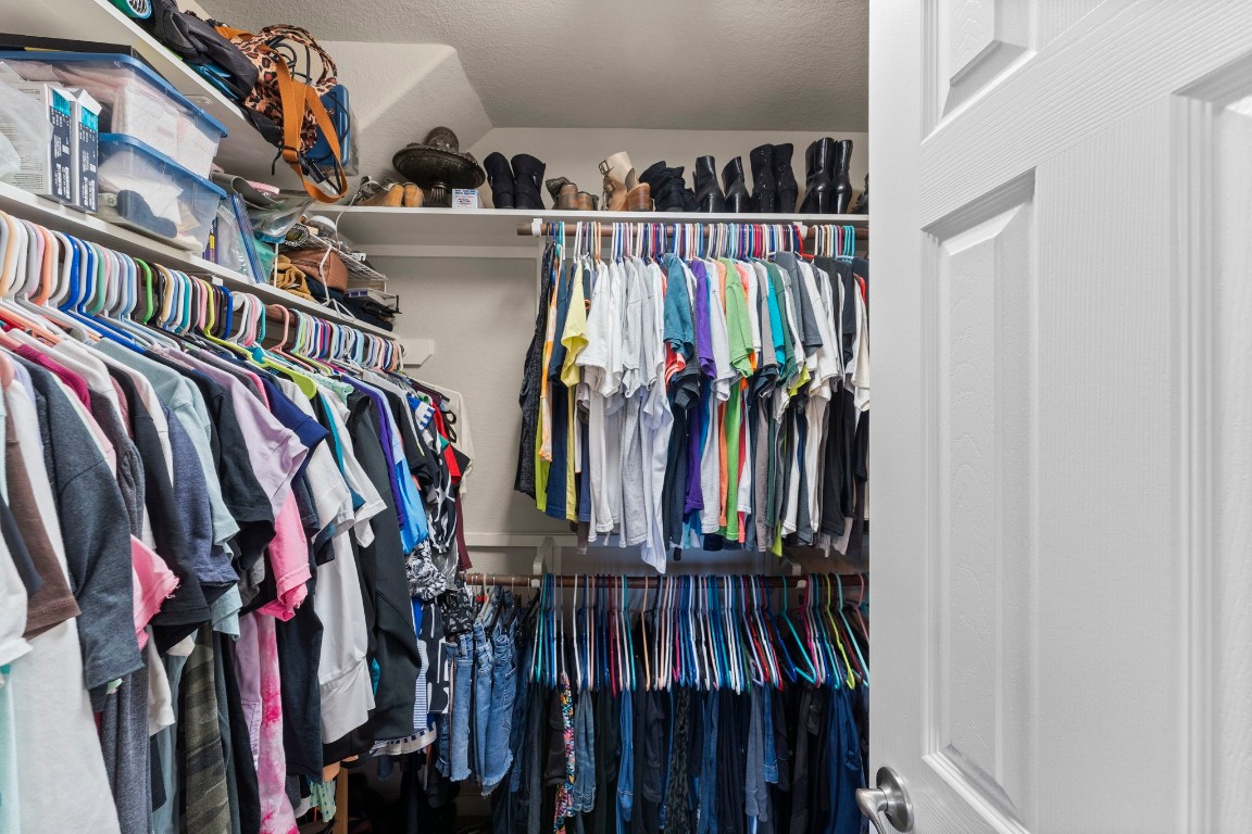 4618 Countrypines Drive Spring, TX 77388 - Photo 32 of 48 a view of walk in closet with clothes