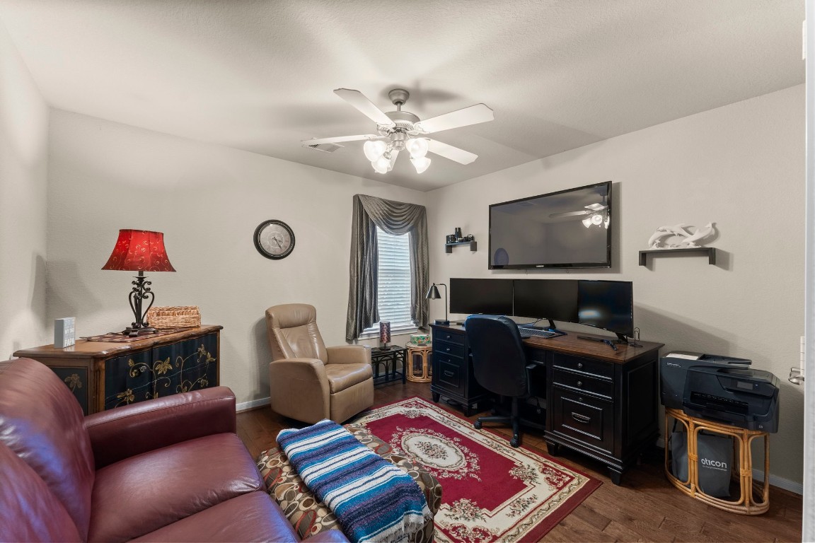 4618 Countrypines Drive Spring, TX 77388 - Photo 33 of 48 a living room with furniture a flat screen tv and gym equipment