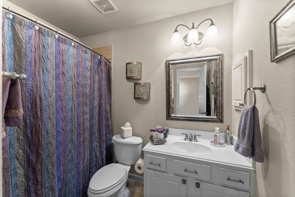 4618 Countrypines Drive Spring, TX 77388 - Photo 35 of 48 a bathroom with a sink vanity mirror and toilet