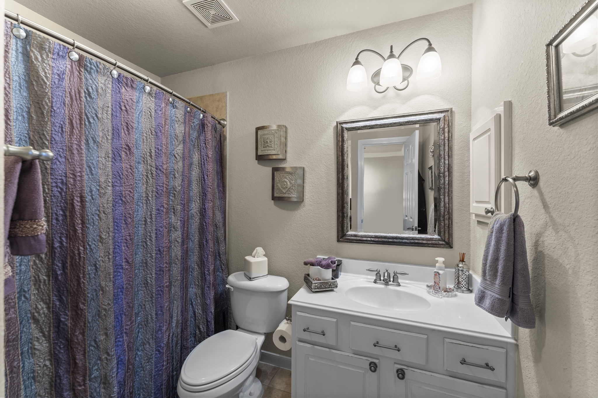 4618 Countrypines Drive Spring, TX 77388 - Photo 35 of 48 a bathroom with a sink vanity mirror and toilet
