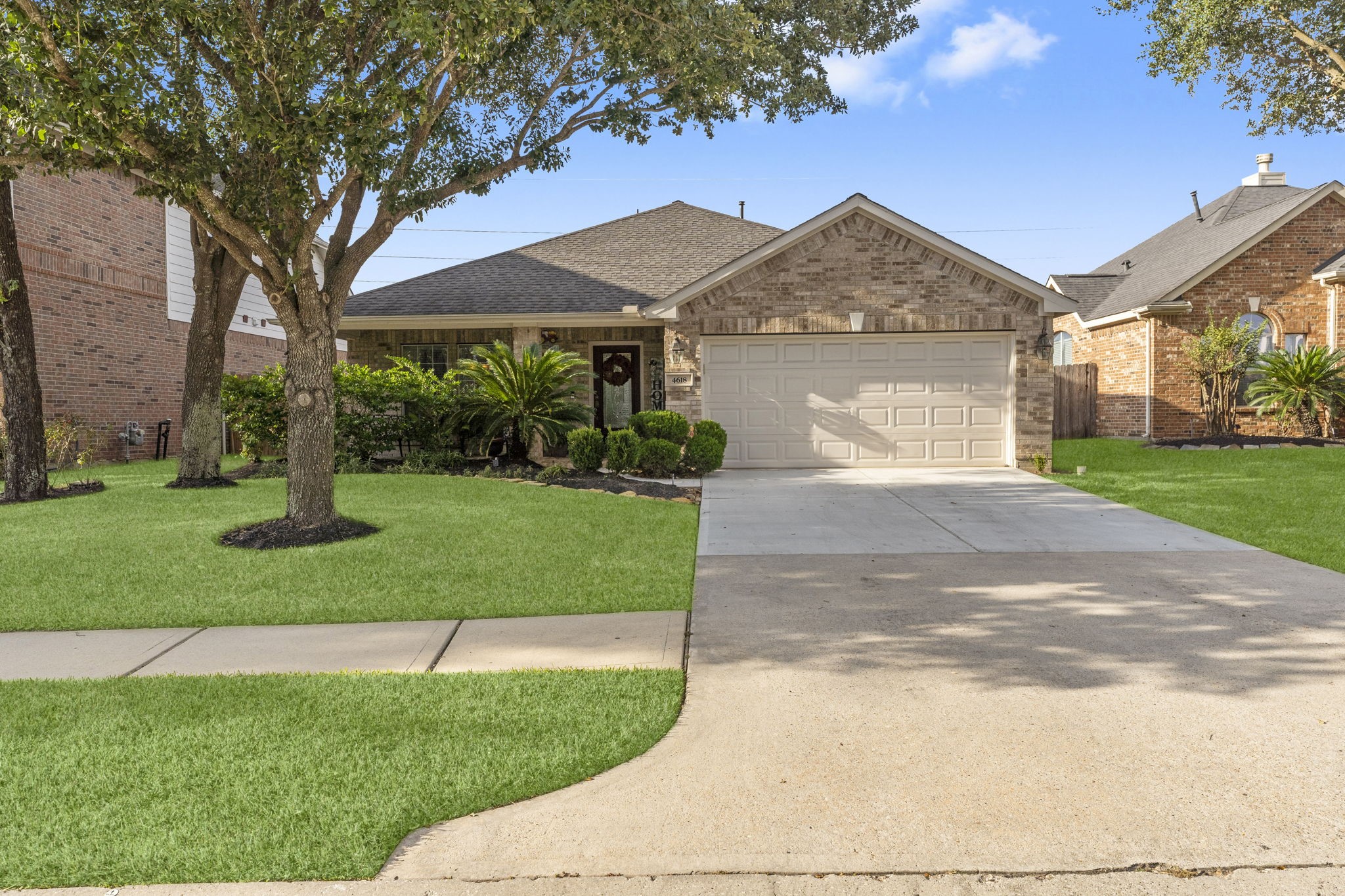 4618 Countrypines Drive Spring, TX 77388 - Photo 4 of 48 a front view of a house with a yard and garage