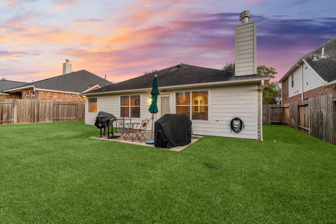 4618 Countrypines Drive Spring, TX 77388 - Photo 47 of 48 a front view of a house with a garden and yard