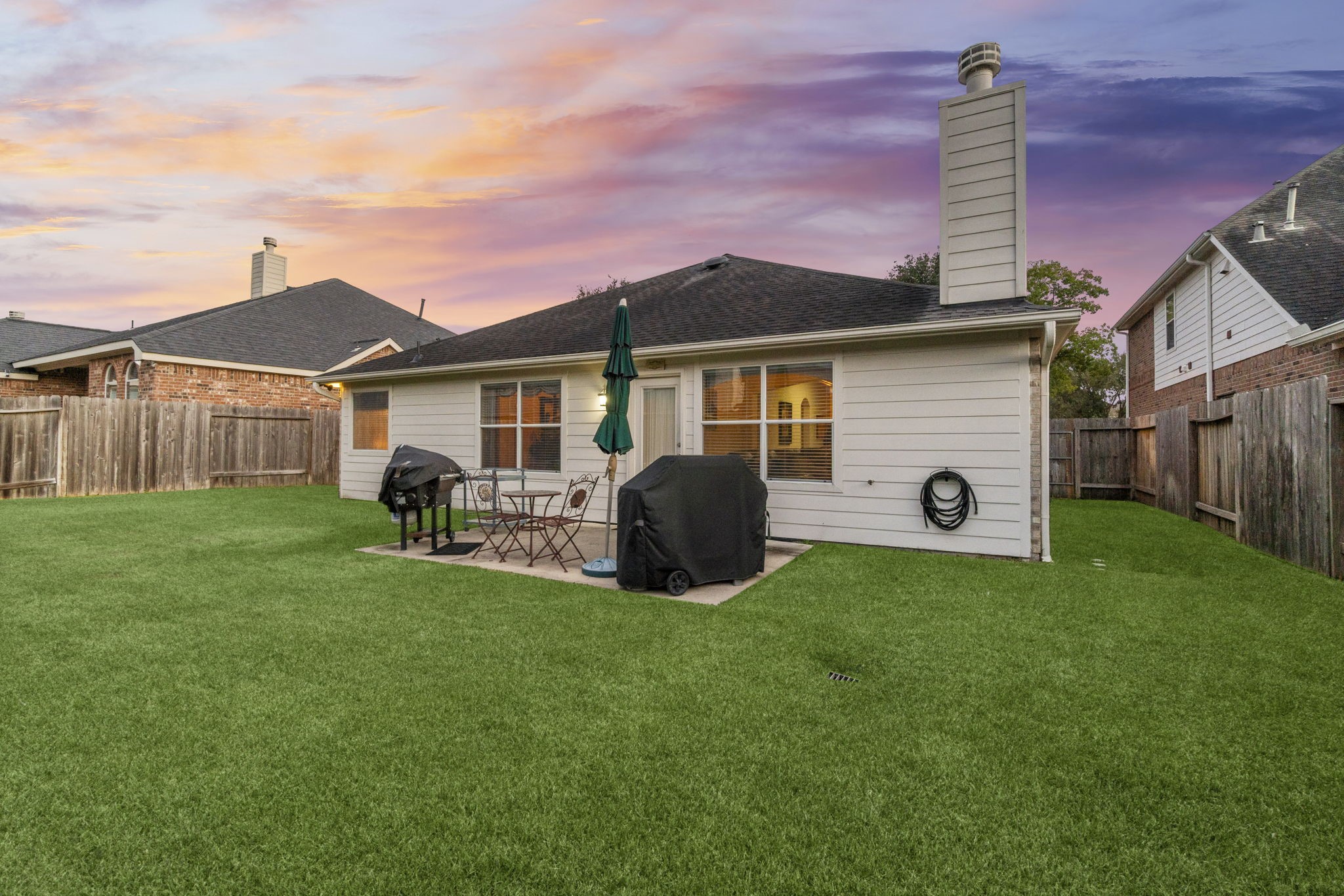 4618 Countrypines Drive Spring, TX 77388 - Photo 47 of 48 a front view of a house with a garden and yard