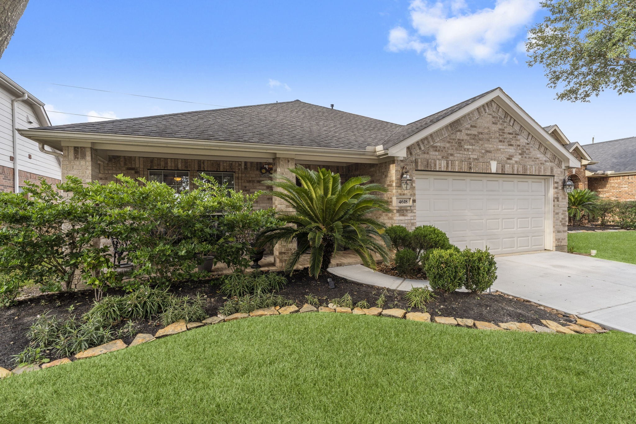 4618 Countrypines Drive Spring, TX 77388 - Photo 5 of 48 a front view of house with a garden