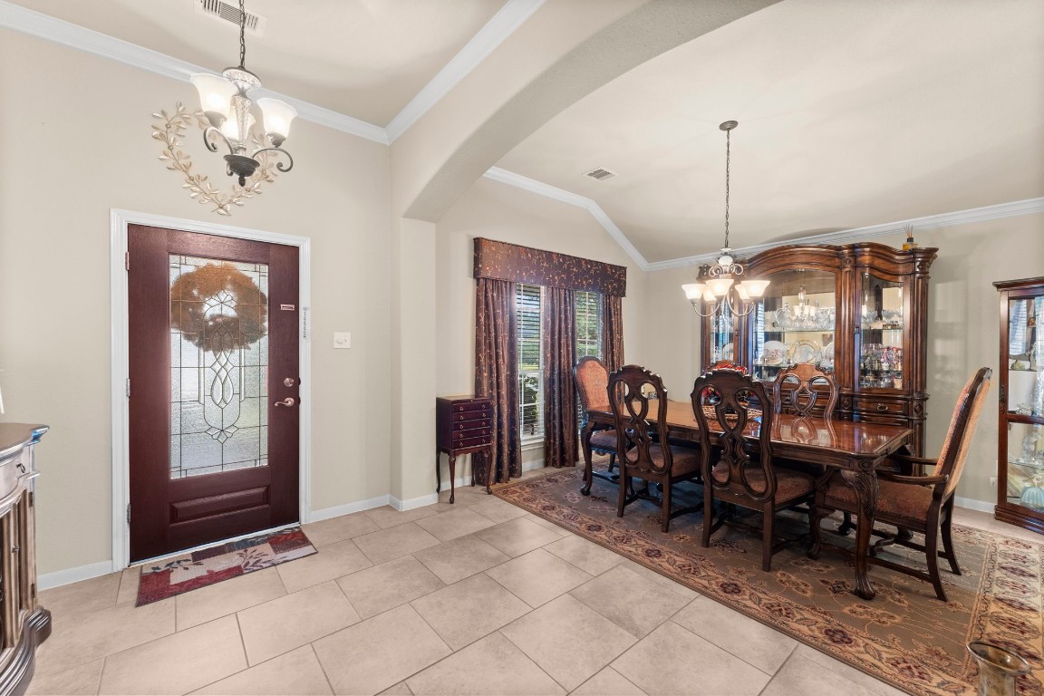 4618 Countrypines Drive Spring, TX 77388 - Photo 10 of 48 a view of a dining room with furniture and chandelier