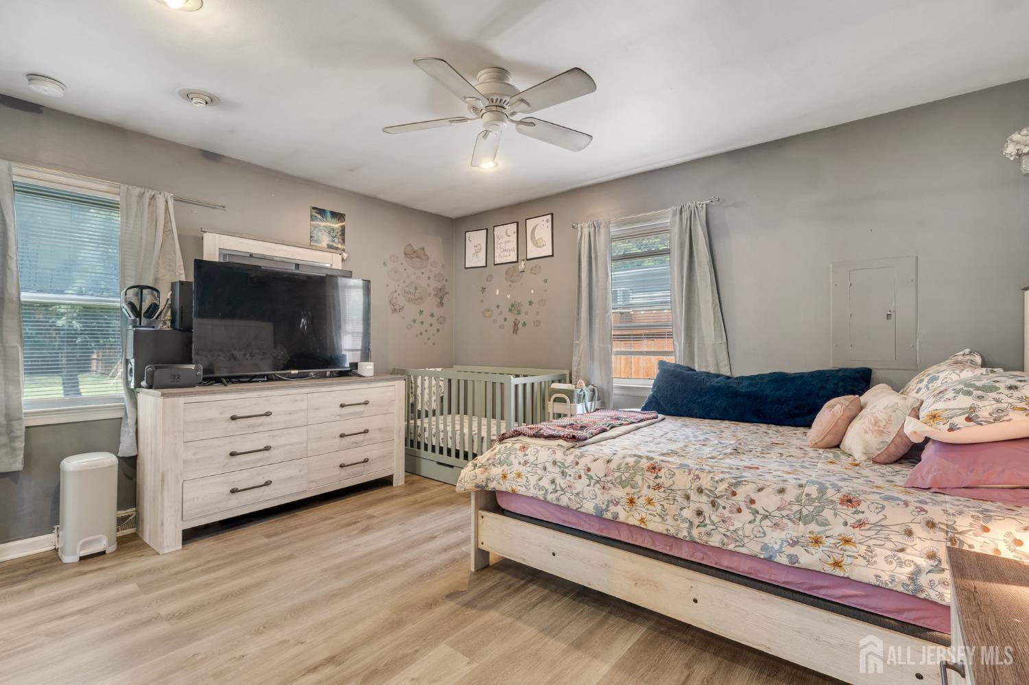 12 Pierrepont Avenue Middlesex, NJ 08846 - Photo 14 of 30 a bedroom with a large bed and a flat screen tv