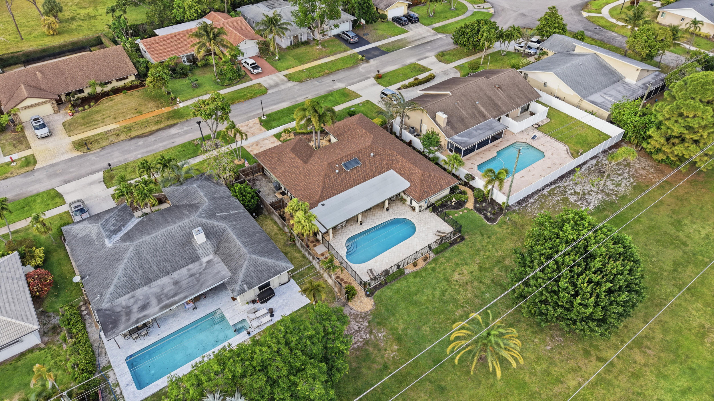 4780 Brandywine Drive Boca Raton, FL 33487 - Photo 42 of 43 an aerial view of a house with a garden