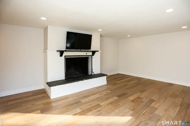 a view of kitchen with microwave and cabinets