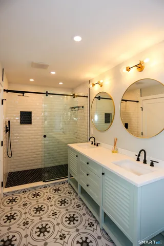 a bathroom with a sink and a mirror