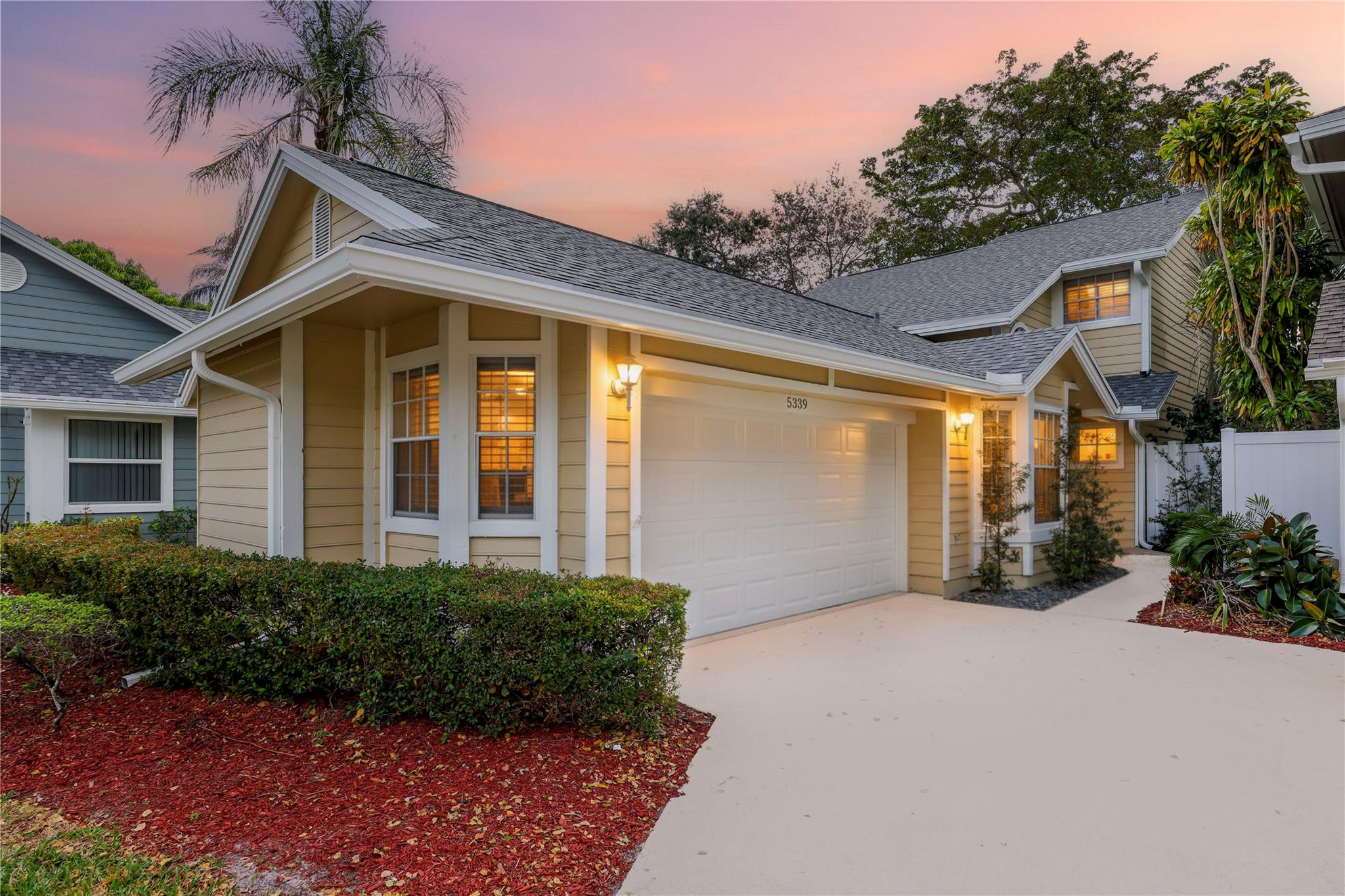 5339 Park Pl Circle Boca Raton, FL 33431 - Photo 1 of 46 a front view of a house with garden