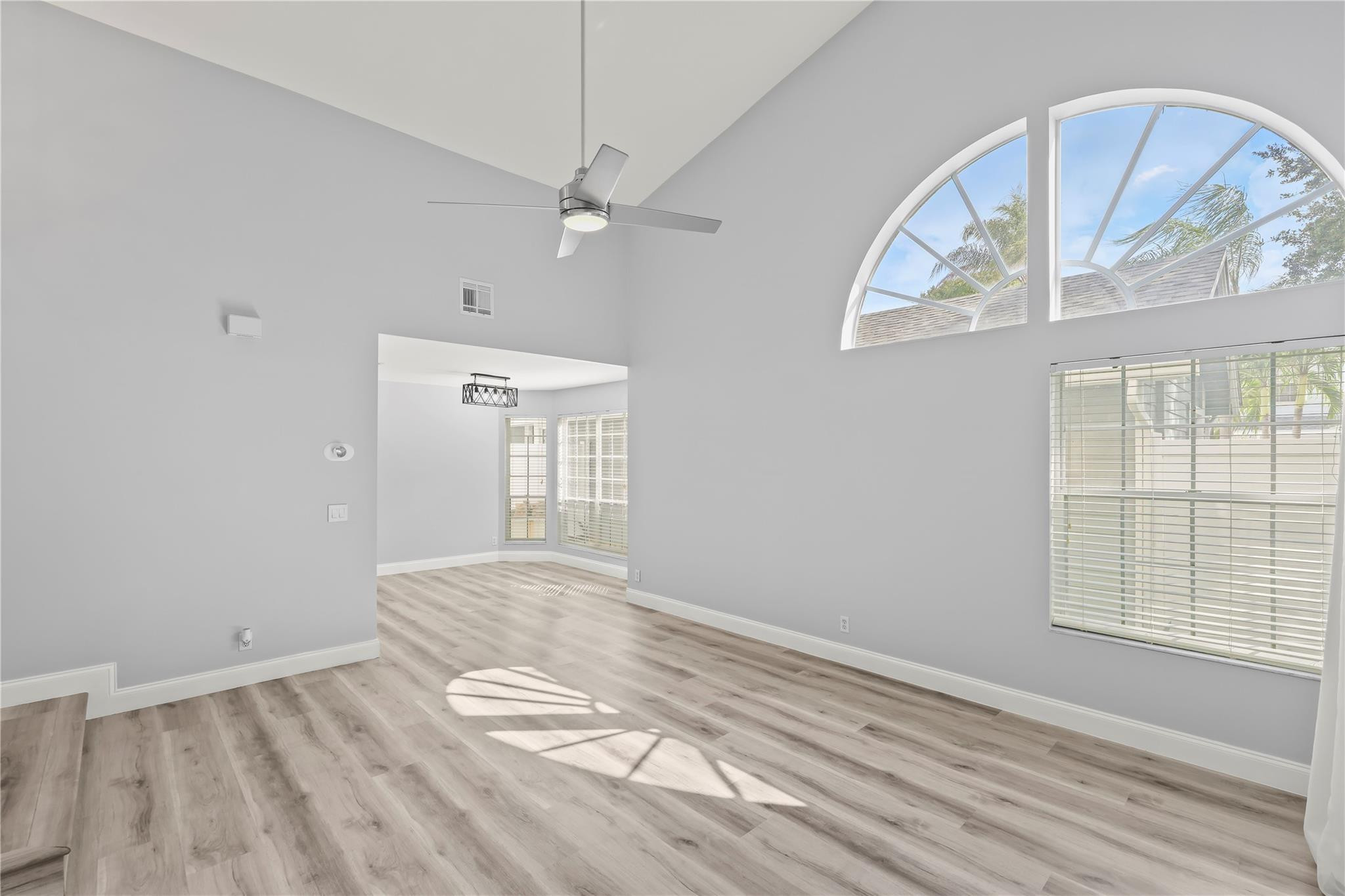 5339 Park Pl Circle Boca Raton, FL 33431 - Photo 14 of 46 a view of empty room with wooden floor and fan