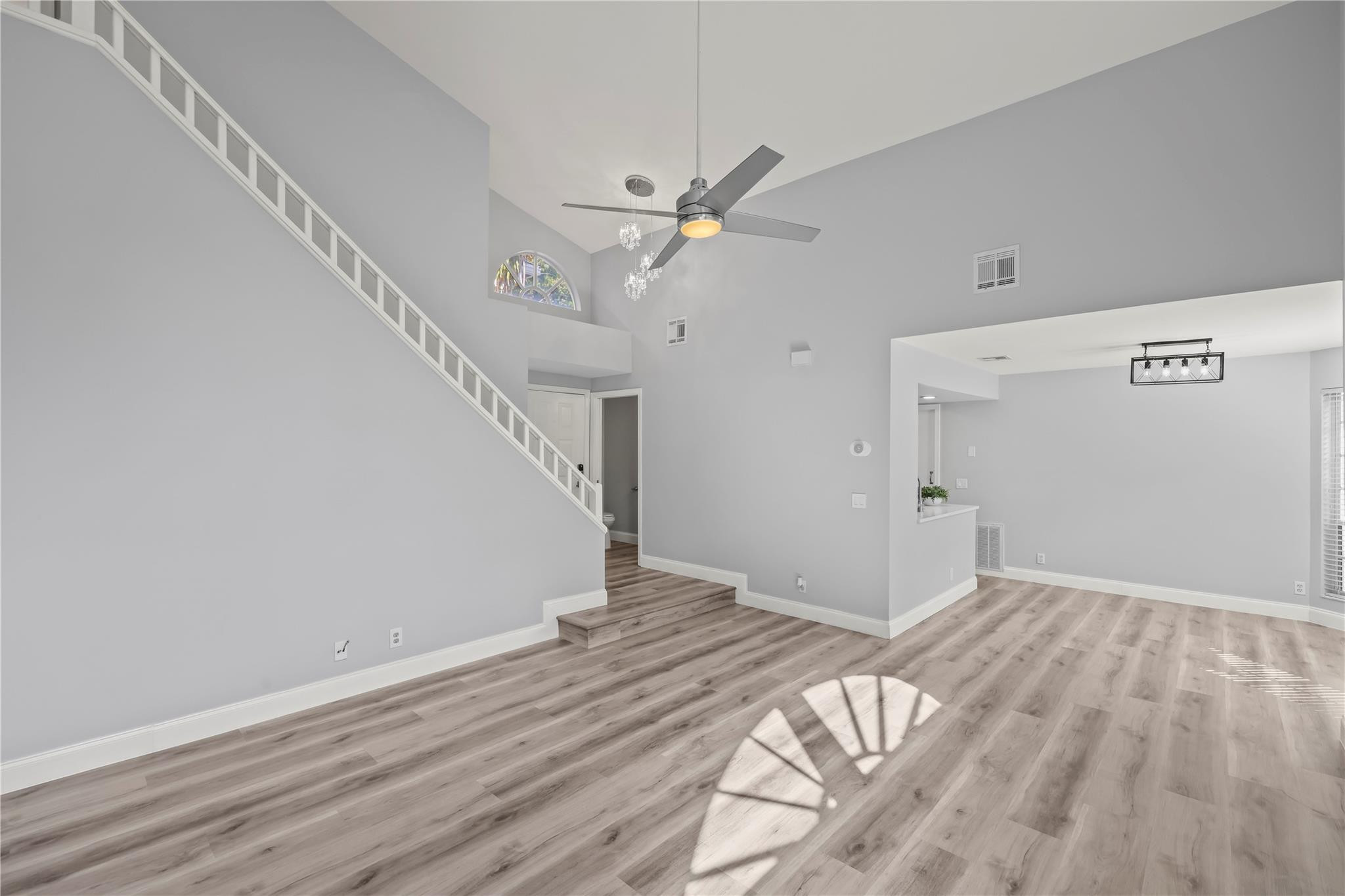 5339 Park Pl Circle Boca Raton, FL 33431 - Photo 15 of 46 a view of a big room with wooden floor and ceiling fan