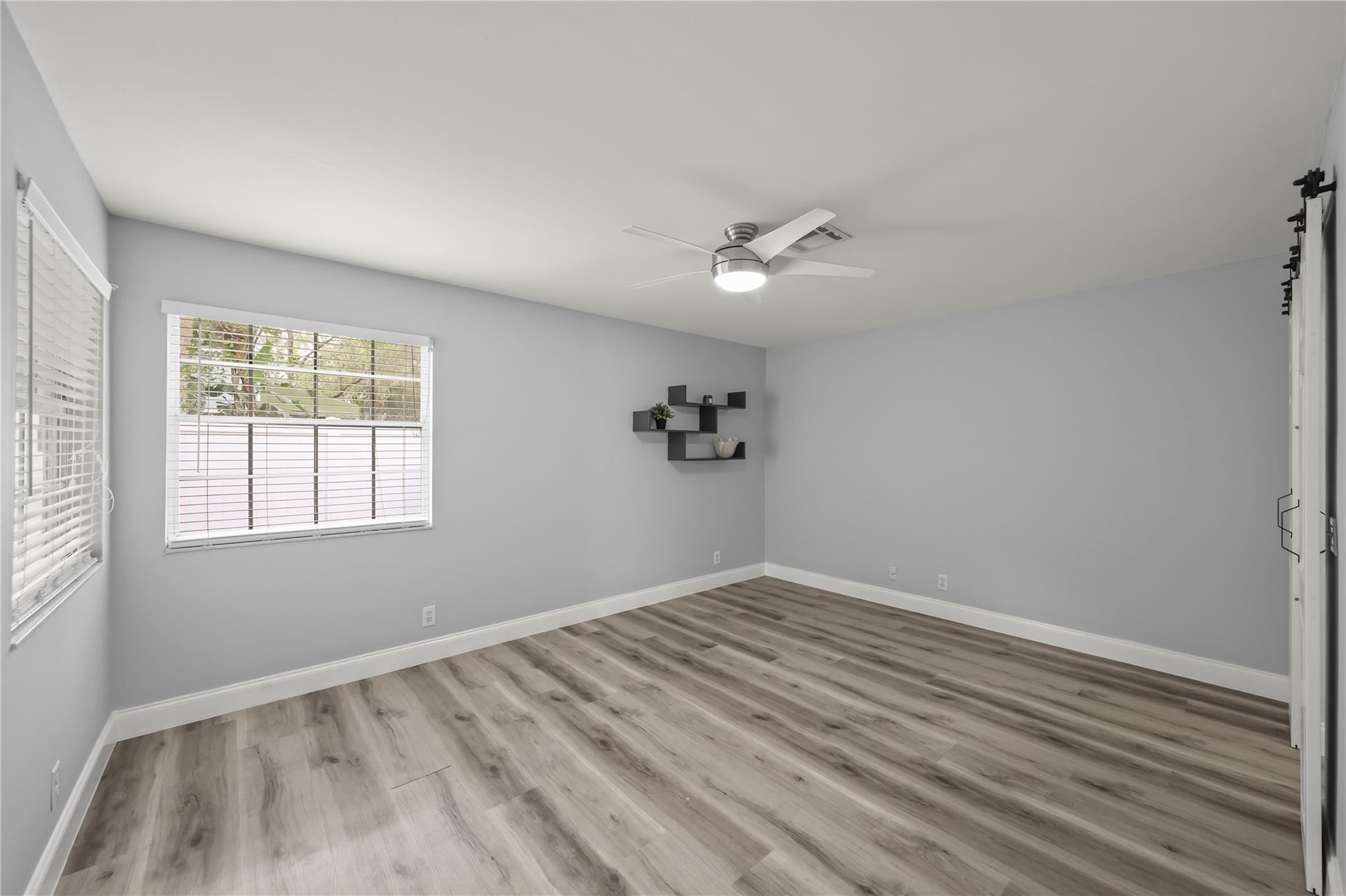 5339 Park Pl Circle Boca Raton, FL 33431 - Photo 17 of 46 wooden floor in an empty room with a window
