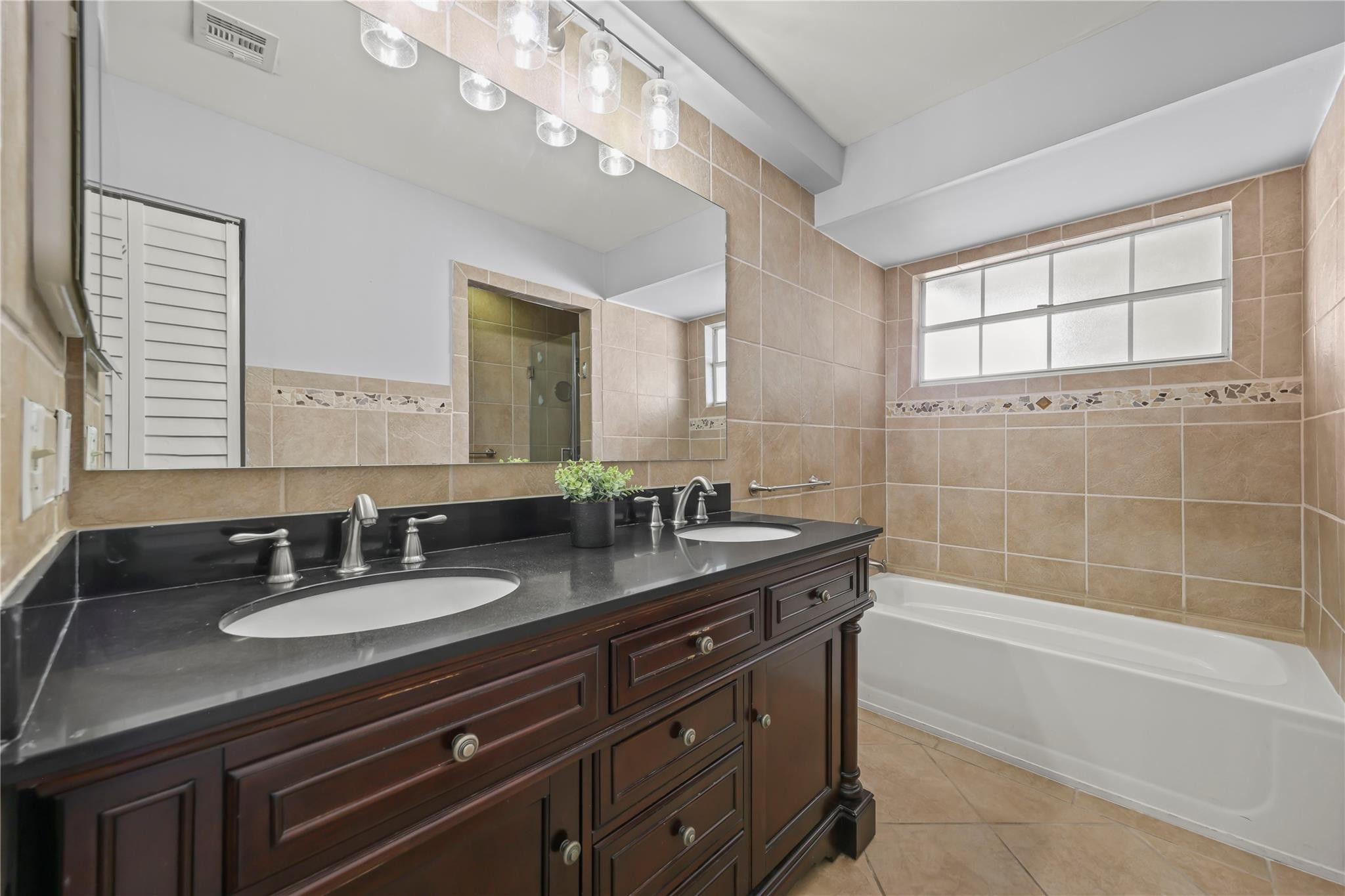 5339 Park Pl Circle Boca Raton, FL 33431 - Photo 18 of 46 a bathroom with a granite countertop sink mirror and bathtub