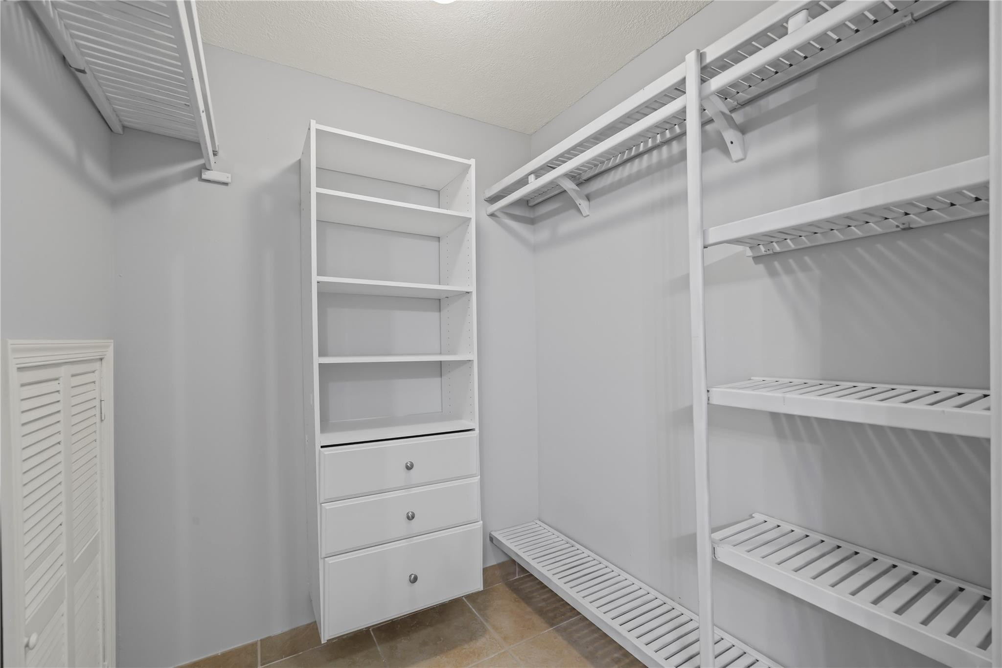 5339 Park Pl Circle Boca Raton, FL 33431 - Photo 21 of 46 a view of walk in closet with empty racks