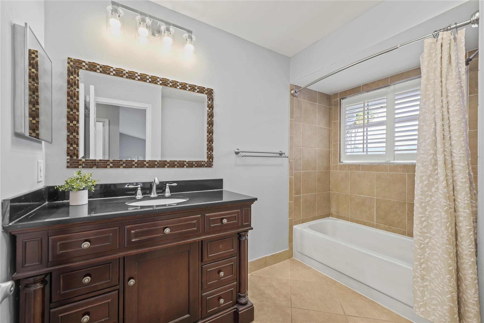 5339 Park Pl Circle Boca Raton, FL 33431 - Photo 29 of 46 a bathroom with a tub a sink and mirror
